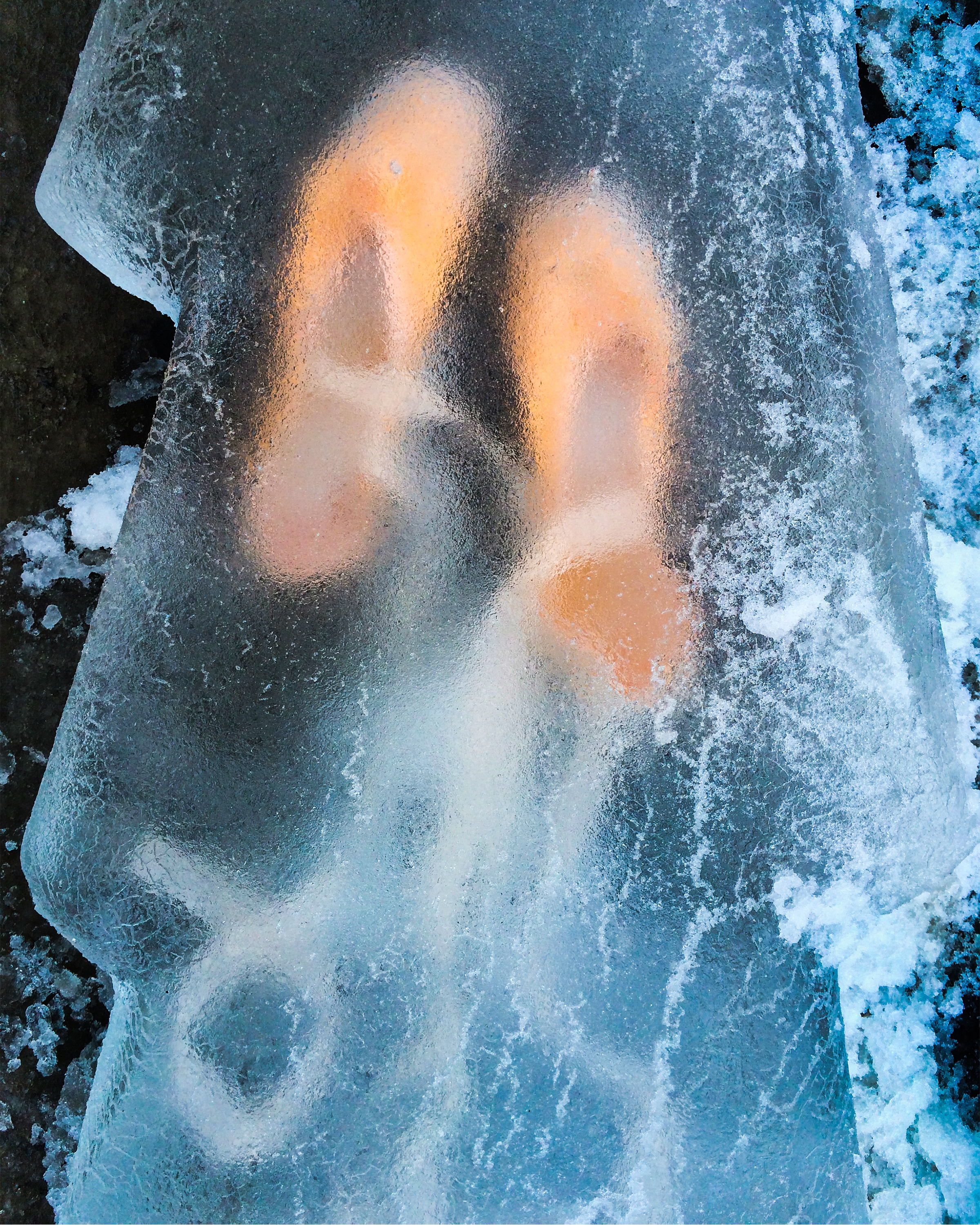 Ballet shoes frozen in ice in the streets of New York City.